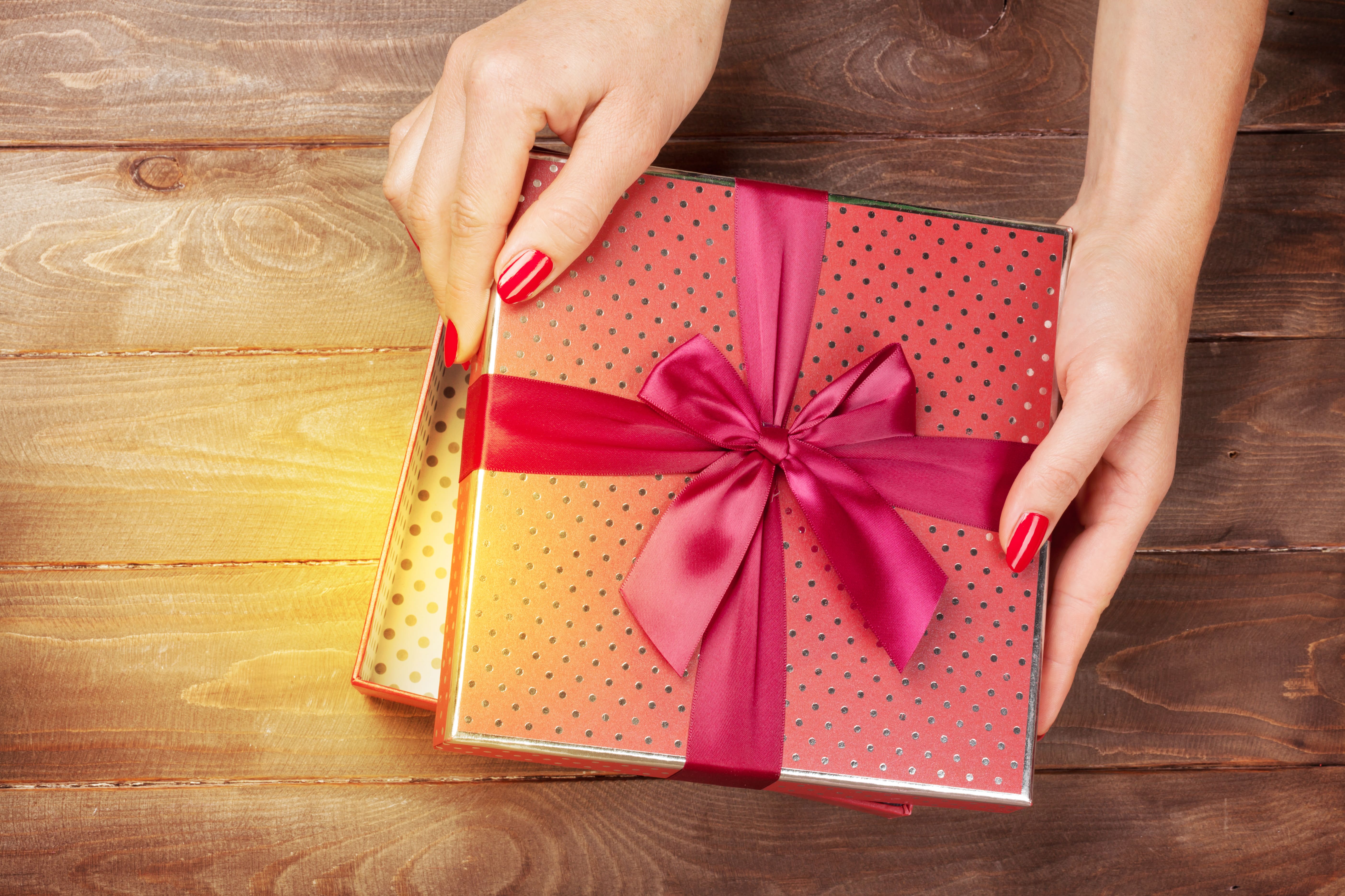 woman opening box to illustrate hamper and gift prizes | Element London