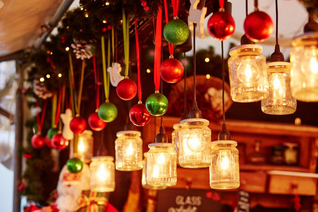 Colorful Christmas decorations and glass lanterns on a Parisian Christmas market to illustrate Luxury Christmas Market Breaks christmas incentives | Element